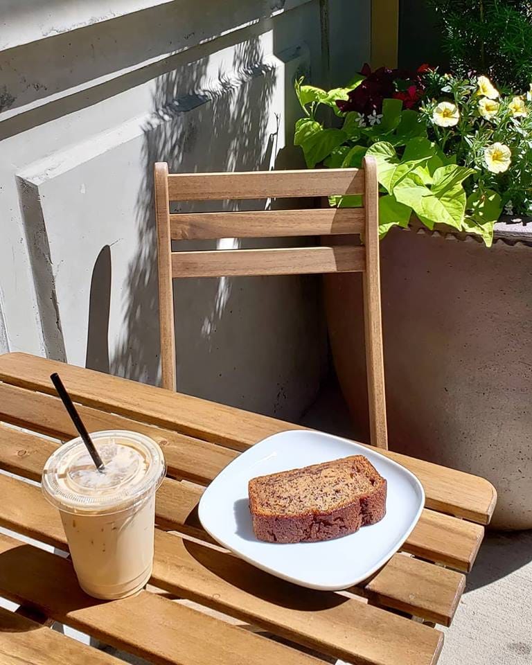 Coffee and treat on outdoor patio table